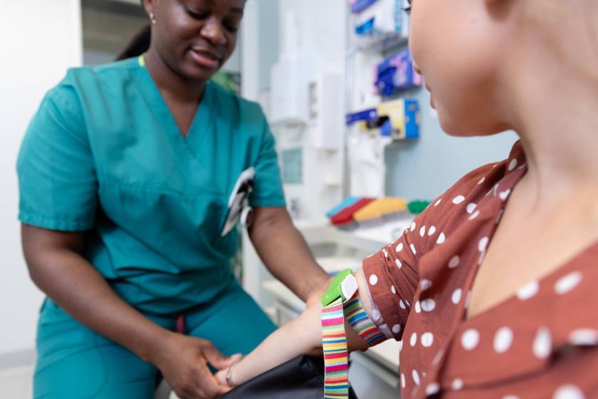A laboratory nurse is preparing to take a sample from a patient's arm.