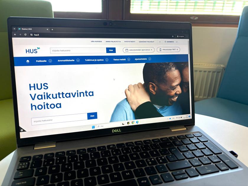 HUS.fi-verkkosivuston etusivu. Näytöllä teksti Vaikuttavinta hoitoa ja kaksi henkilöä lähekkäin.